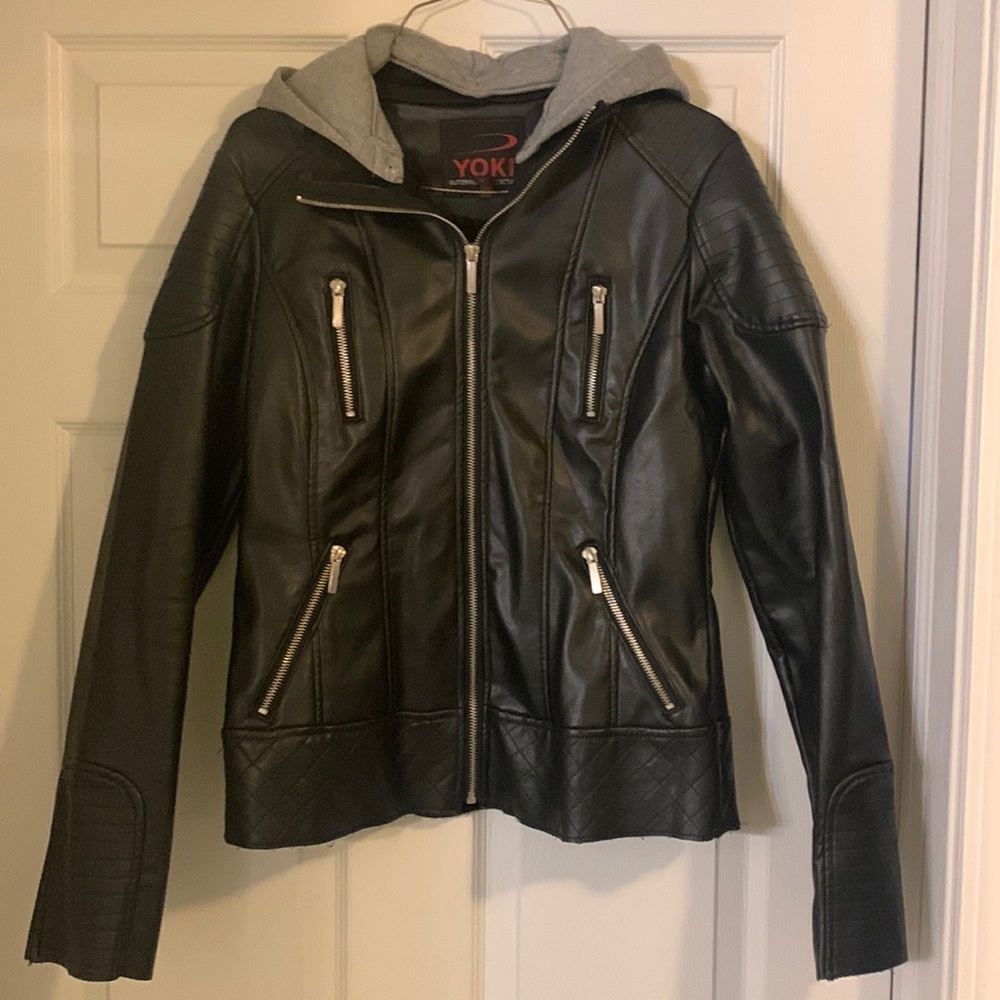 Women’s faux leather jacket with sweatshirt material hood.